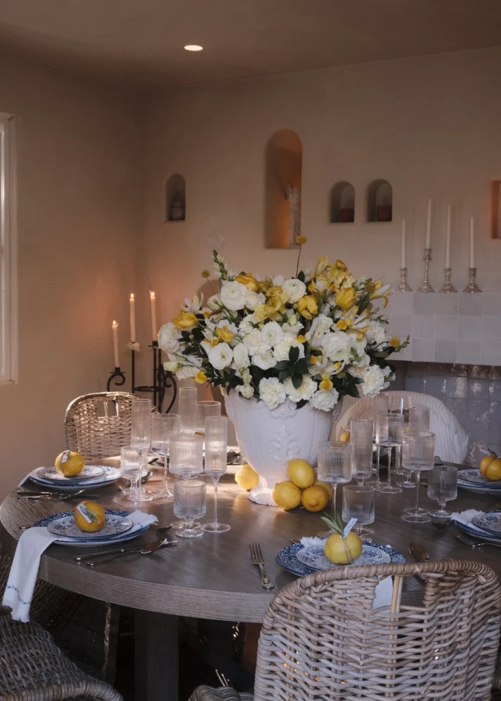 Private dinner setting with flowers, candles and lemons